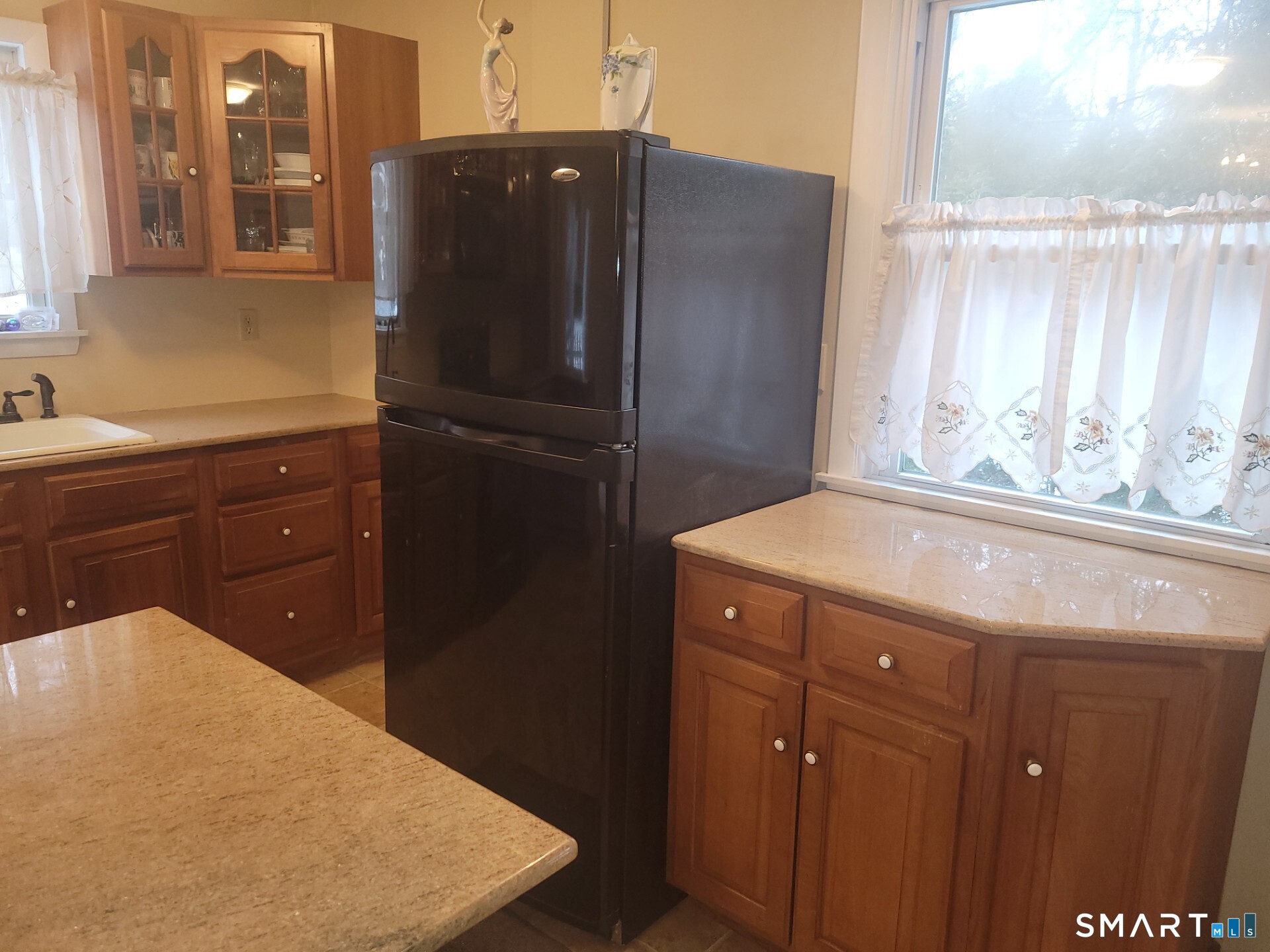41 East Granby Road Granby, CT 06035 - Photo 32 of 61 a kitchen with a refrigerator and window
