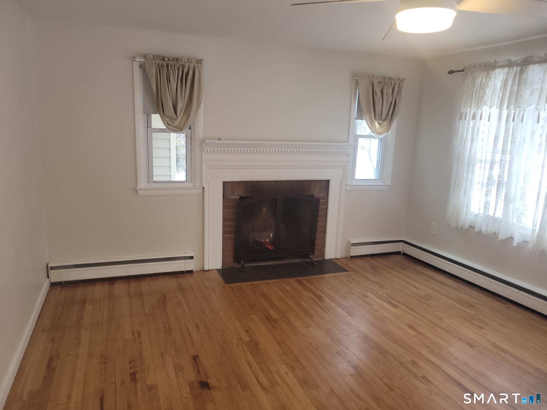 41 East Granby Road Granby, CT 06035 - Photo 35 of 61 a view of an empty room with wooden floor and a window