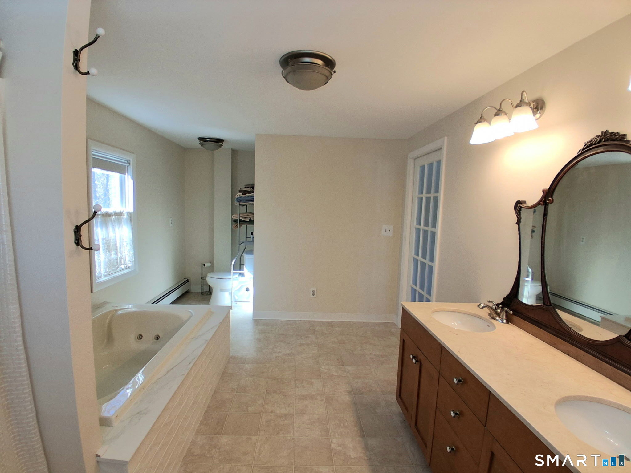 41 East Granby Road Granby, CT 06035 - Photo 38 of 61 a bathroom with a tub sink and mirror