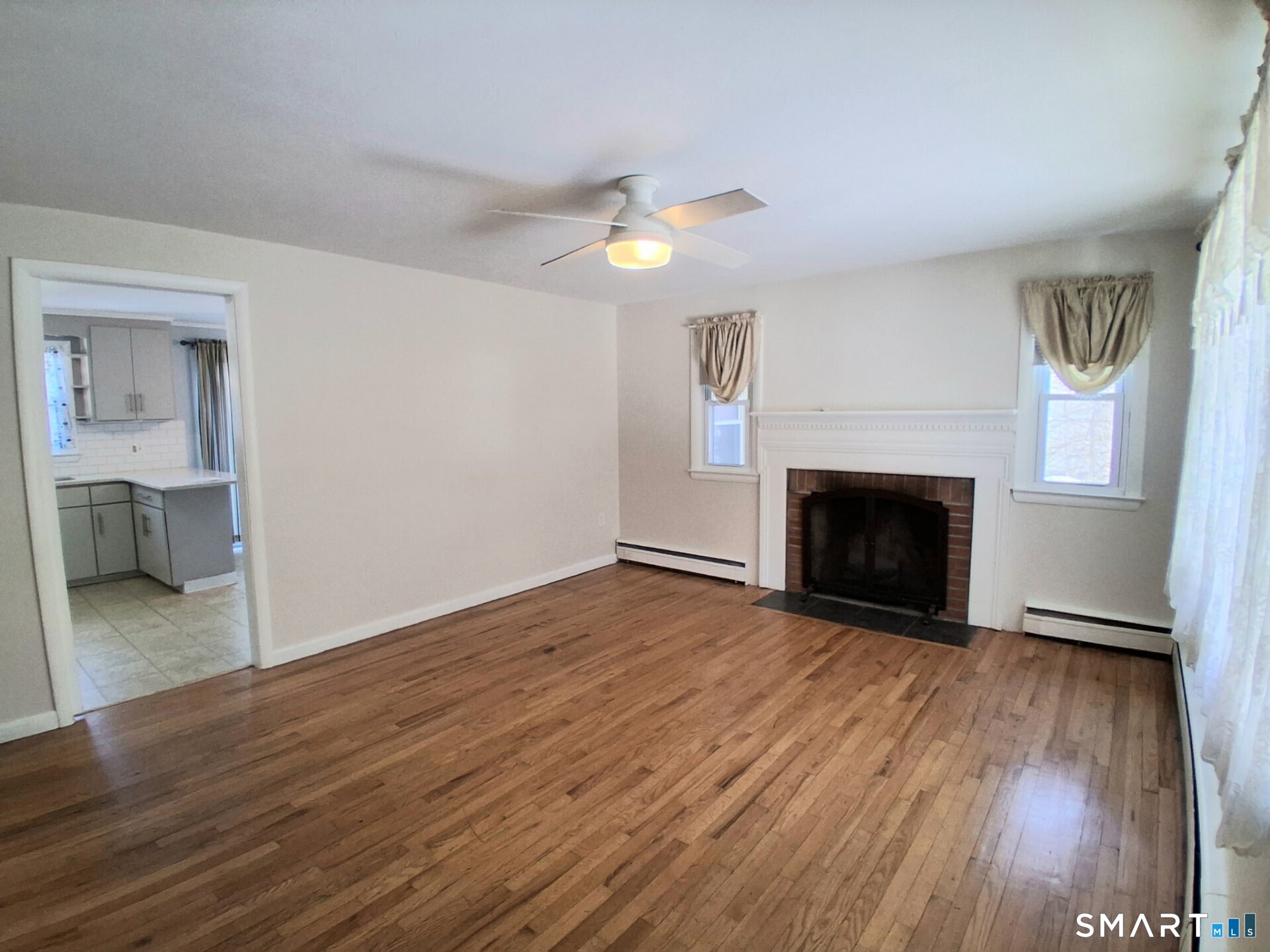 41 East Granby Road Granby, CT 06035 - Photo 39 of 61 a view of empty room with wooden floor and fireplace