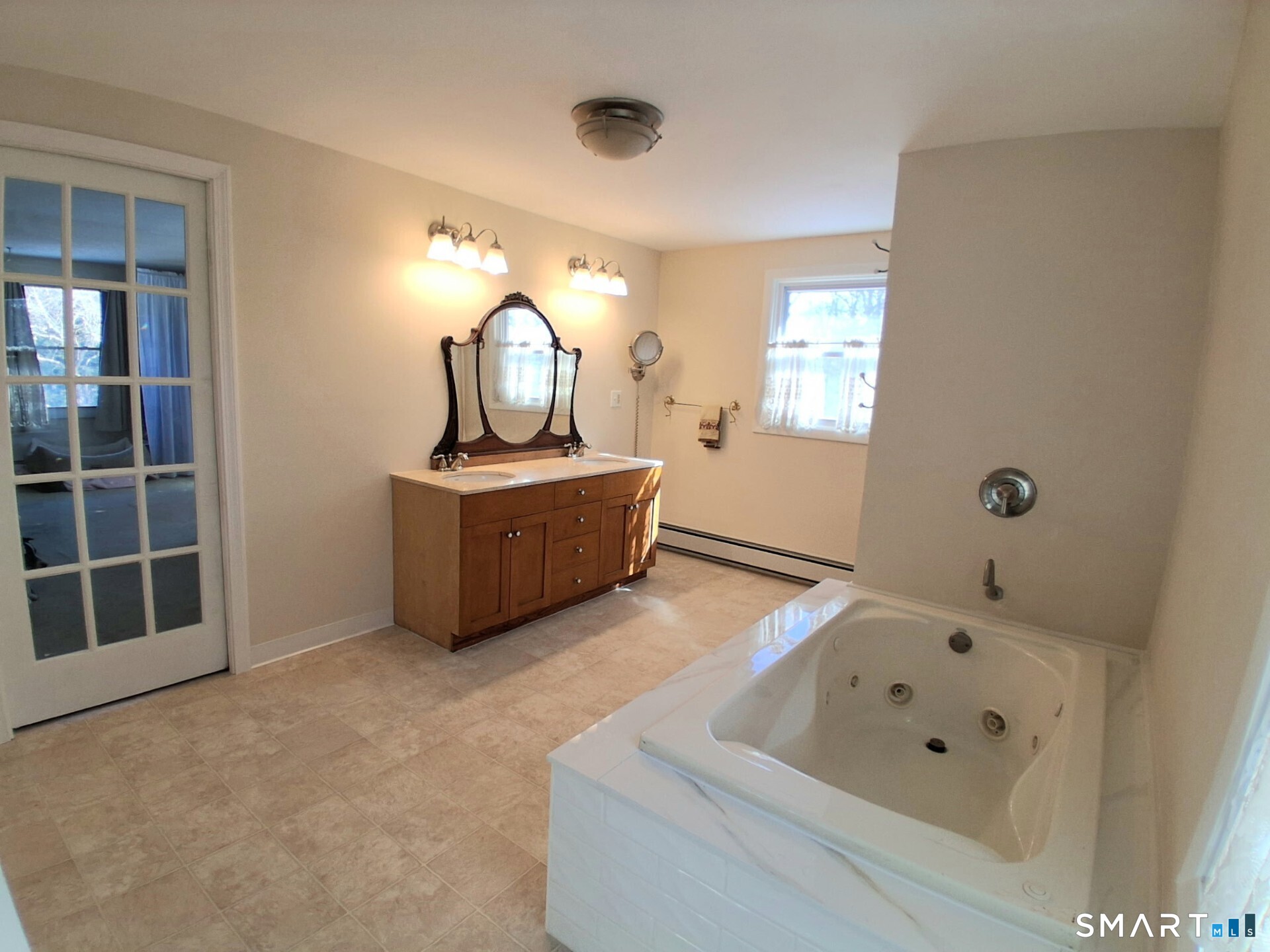 41 East Granby Road Granby, CT 06035 - Photo 44 of 61 a bathroom with a tub sink and mirror