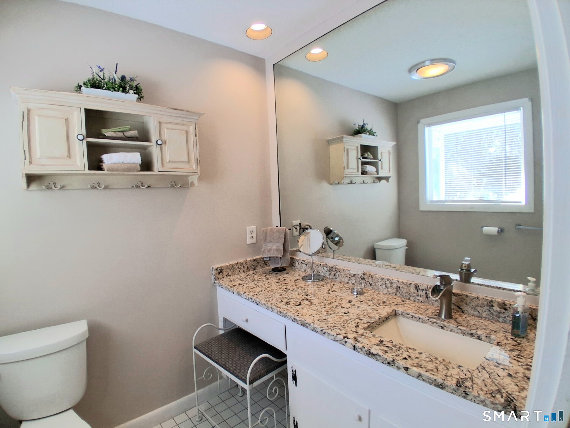 41 East Granby Road Granby, CT 06035 - Photo 47 of 61 a bathroom with a granite countertop toilet sink and mirror