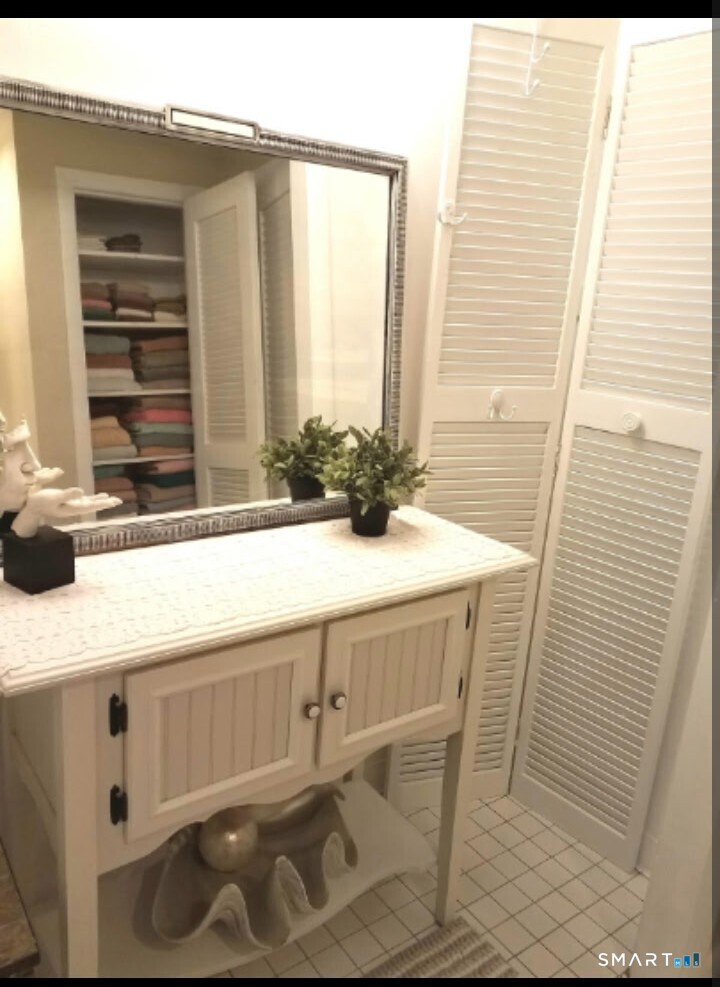 41 East Granby Road Granby, CT 06035 - Photo 51 of 61 a bathroom with a sink and a mirror