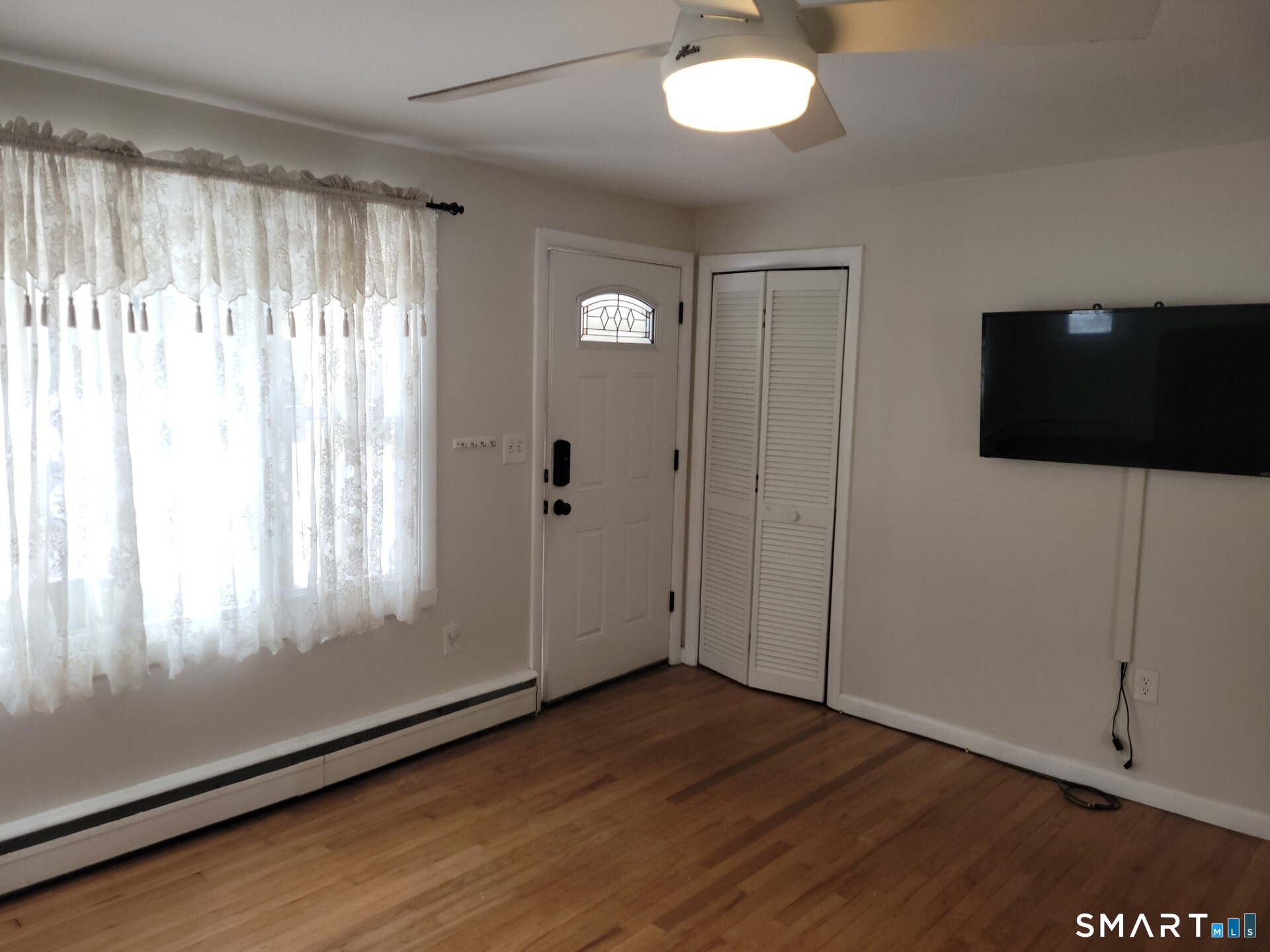 41 East Granby Road Granby, CT 06035 - Photo 8 of 61 a view of a livingroom with wooden floor and windows