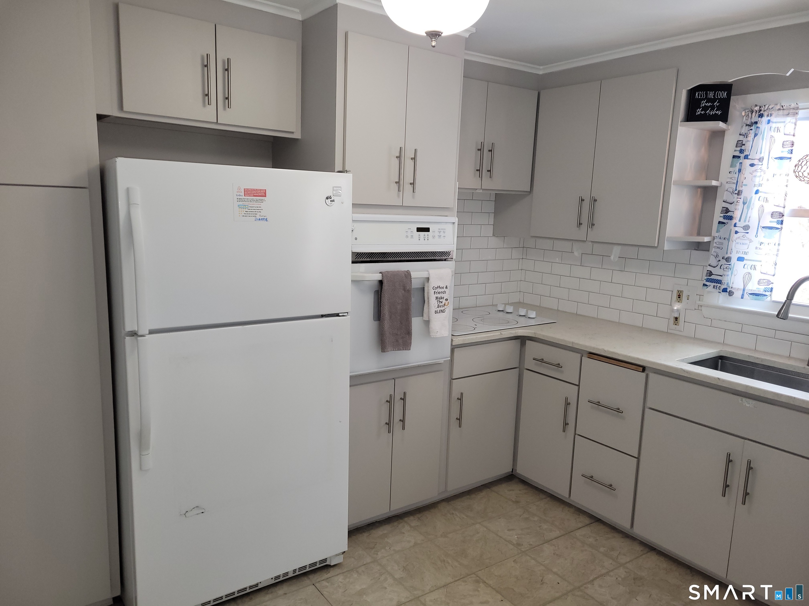 41 East Granby Road Granby, CT 06035 - Photo 9 of 61 a kitchen with cabinets a refrigerator and a sink