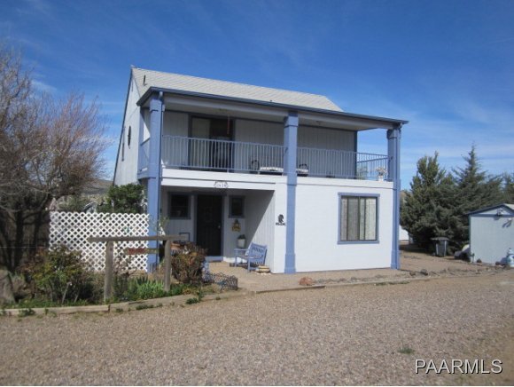 2620 North Reed Road Chino Valley, AZ 86323 - Photo 1 of 23 a front view of a house with a garage