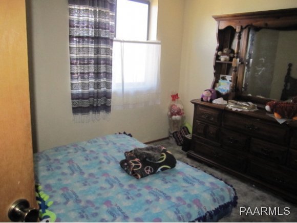 2620 North Reed Road Chino Valley, AZ 86323 - Photo 12 of 23 a room with a bed and a window