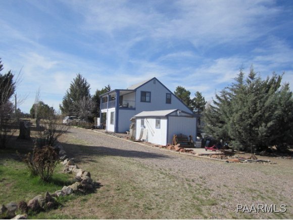 2620 North Reed Road Chino Valley, AZ 86323 - Photo 19 of 23 a view of a house with a yard