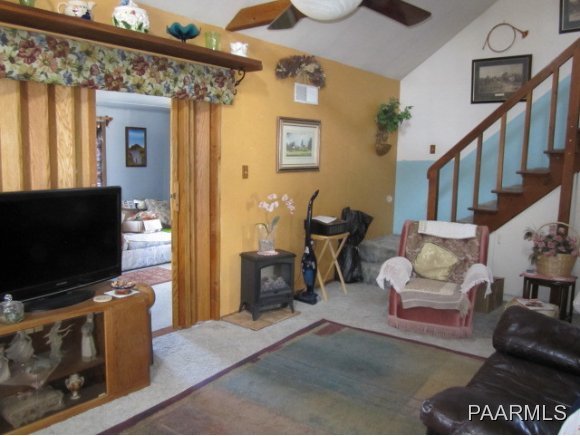 2620 North Reed Road Chino Valley, AZ 86323 - Photo 2 of 23 a living room with furniture and a flat screen tv