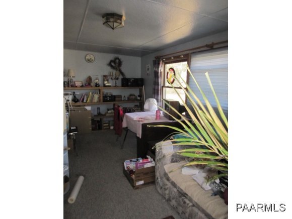 2620 North Reed Road Chino Valley, AZ 86323 - Photo 3 of 23 a living room with furniture and a window