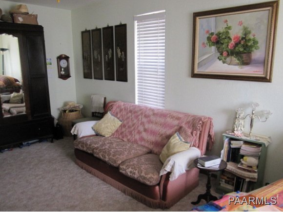 2620 North Reed Road Chino Valley, AZ 86323 - Photo 9 of 23 a living room with furniture and a closet