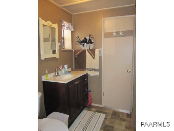 2620 North Reed Road Chino Valley, AZ 86323 - Photo 10 of 23 a bathroom with a sink and a mirror