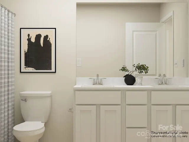 a bathroom with a sink and mirror with toilet