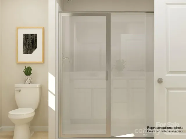 a white toilet sitting next to a bathroom sink