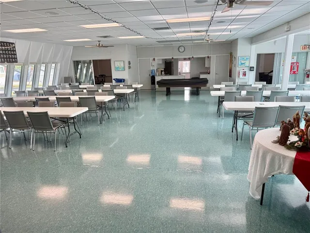 a view of swimming pool with outdoor seating and city view
