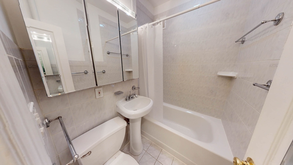 311 Tappan Street, Unit 3 Brookline, MA 02445 - Photo 26 of 35 a bathroom with a sink a toilet and shower