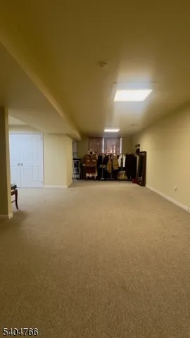 a view of a livingroom with furniture and a garage
