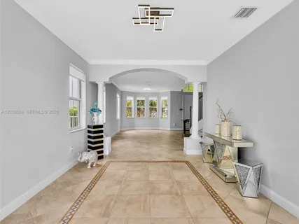 a living room with furniture and a gate