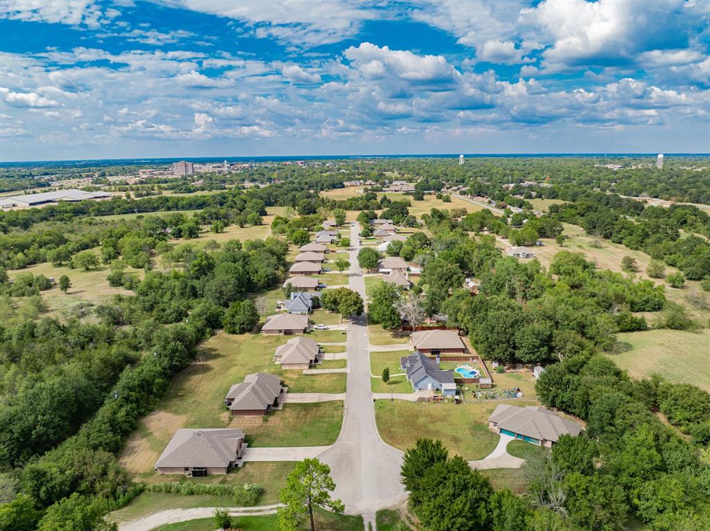 an aerial view of residential houses with outdoor space