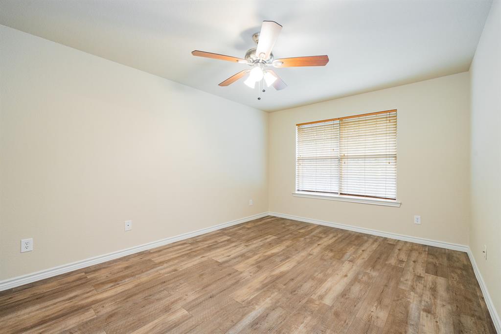 26 Duplex Portfolio Commerce, TX 75428 - Photo 23 of 39 an empty room with windows and fan