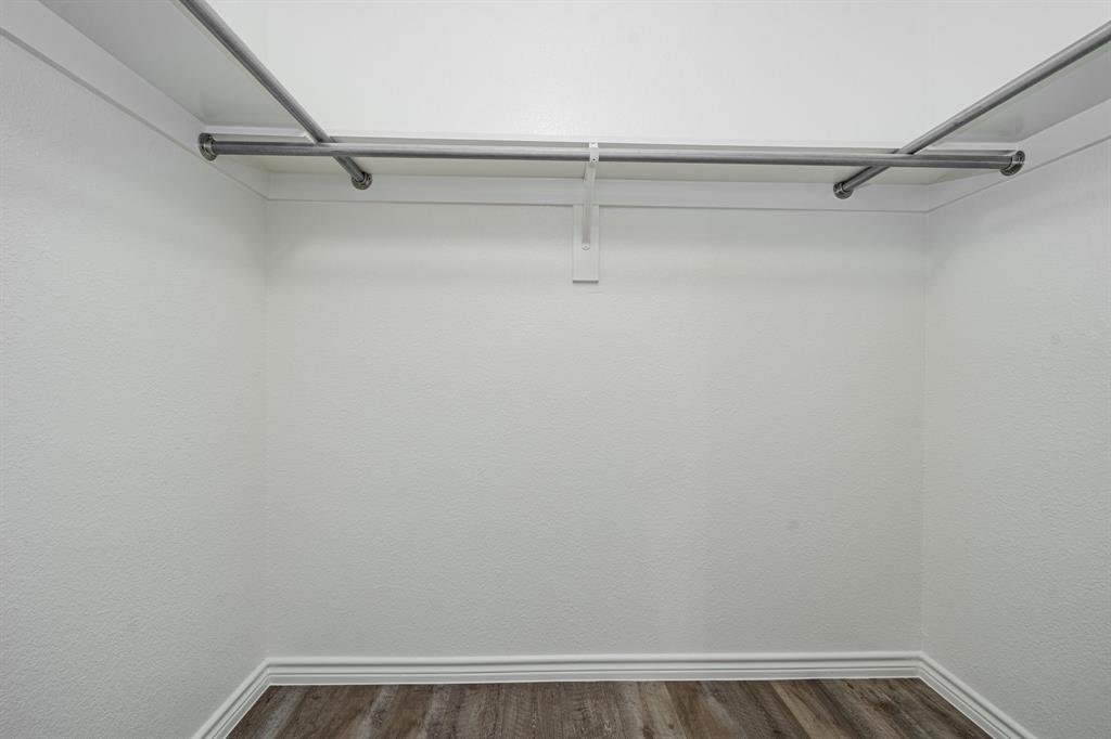 26 Duplex Portfolio Commerce, TX 75428 - Photo 27 of 39 a view of a room with racks on the wall