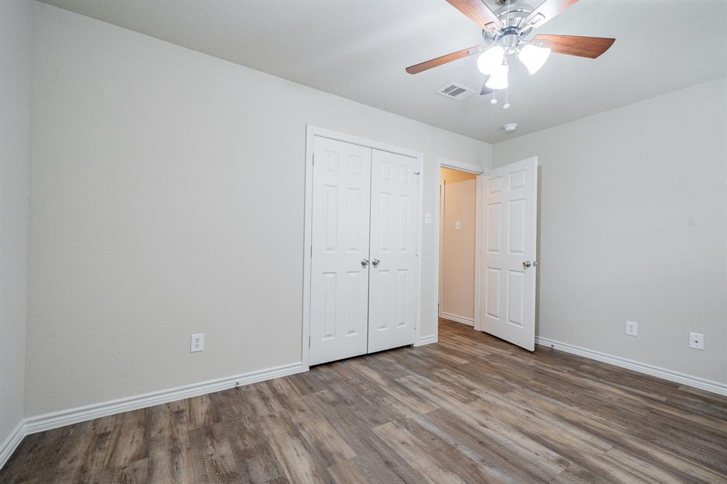26 Duplex Portfolio Commerce, TX 75428 - Photo 30 of 39 wooden floor in an empty room