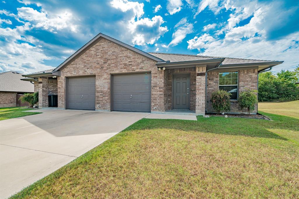 26 Duplex Portfolio Commerce, TX 75428 - Photo 3 of 39 a view of a house with a yard