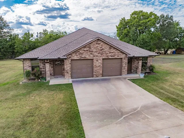 a house with garden in front of it