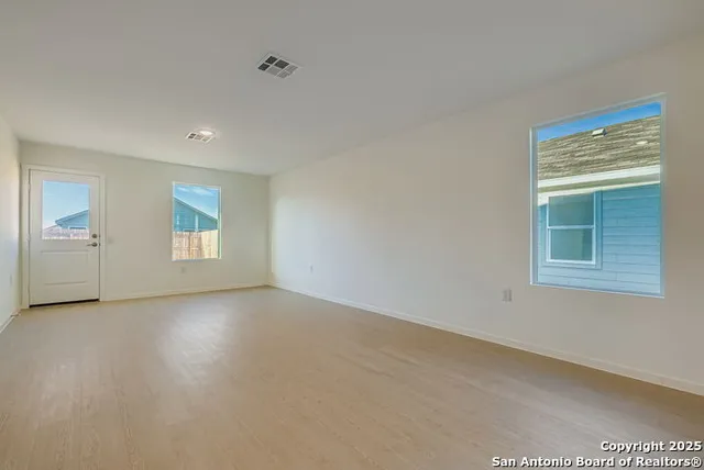 an empty room with windows