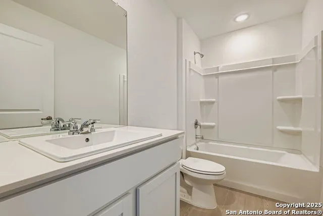 a bathroom with a sink a toilet and a bathtub