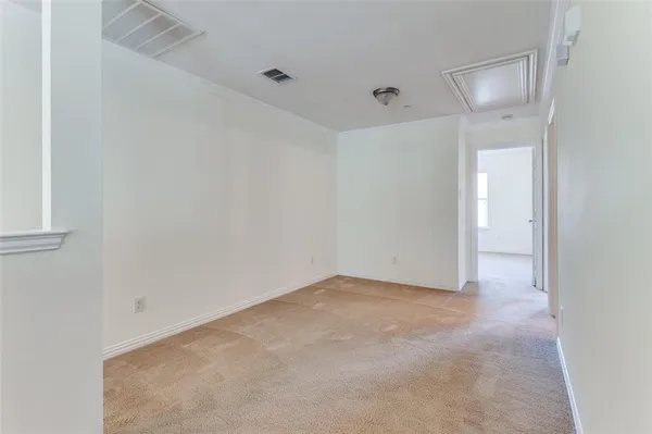 an empty room with a bathroom