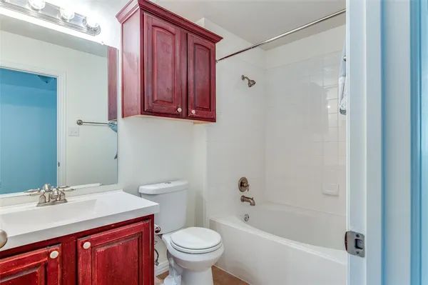a bathroom with a sink a toilet and a bathtub