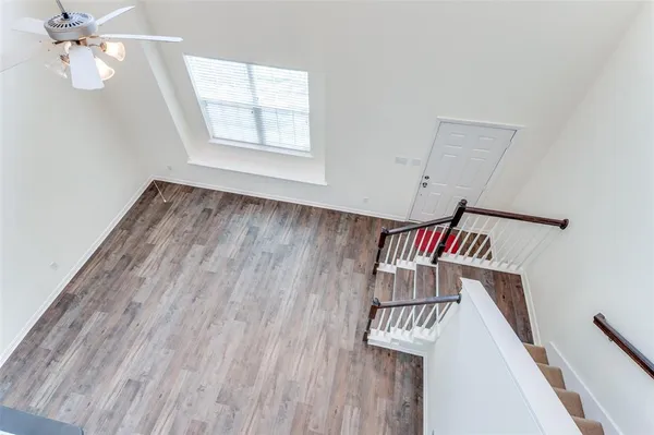 a view of an entryway with wooden floor