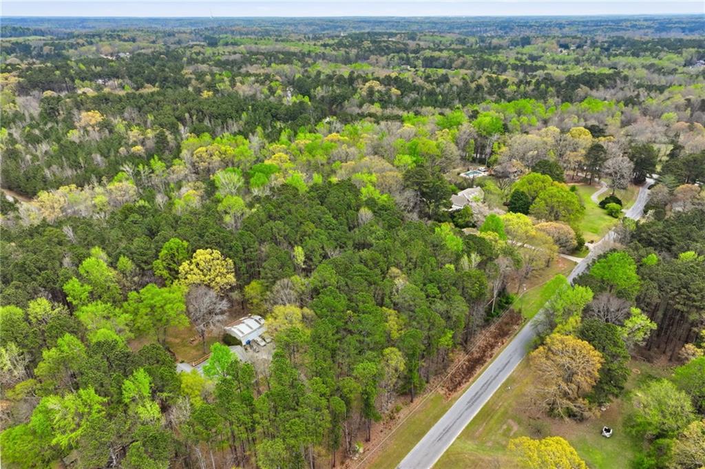 3405 Monica Lane Southwest Conyers, GA 30094 - Photo 17 of 26 a view of a city with lush green forest