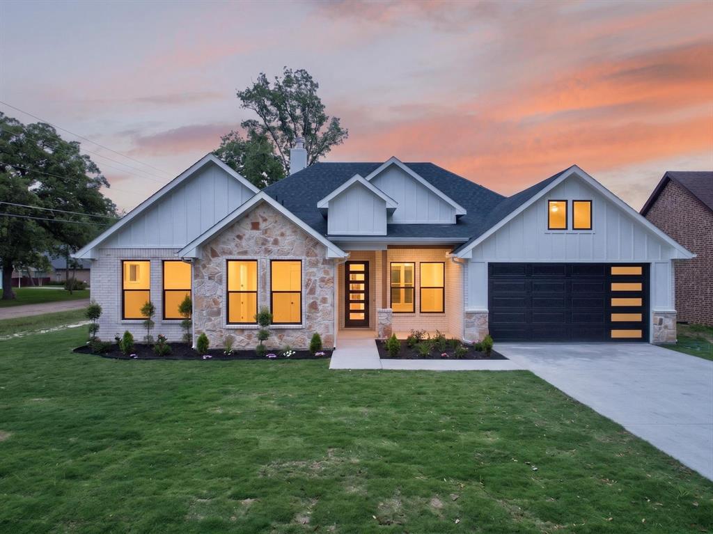 120 Springwood Road Enchanted Oaks, TX 75156 - Photo 1 of 37 Contemporary exterior featuring white brick and natural stone accents