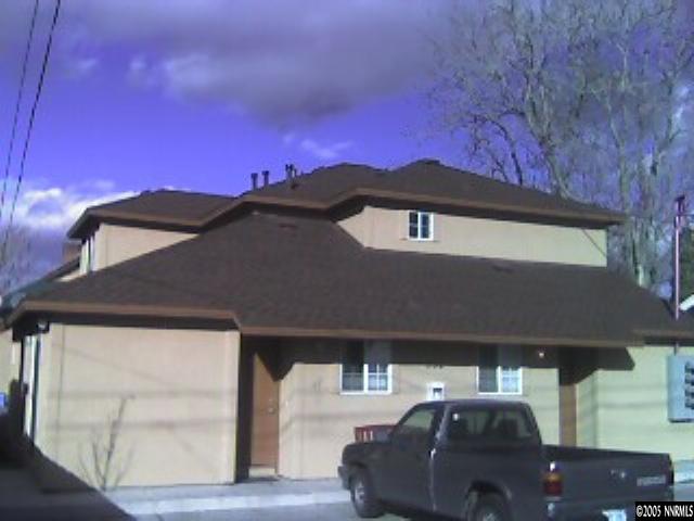 330-332 Stewart Street, Unit 4 Reno, NV 89502 - Photo 2 of 2 a front view of a house with a yard