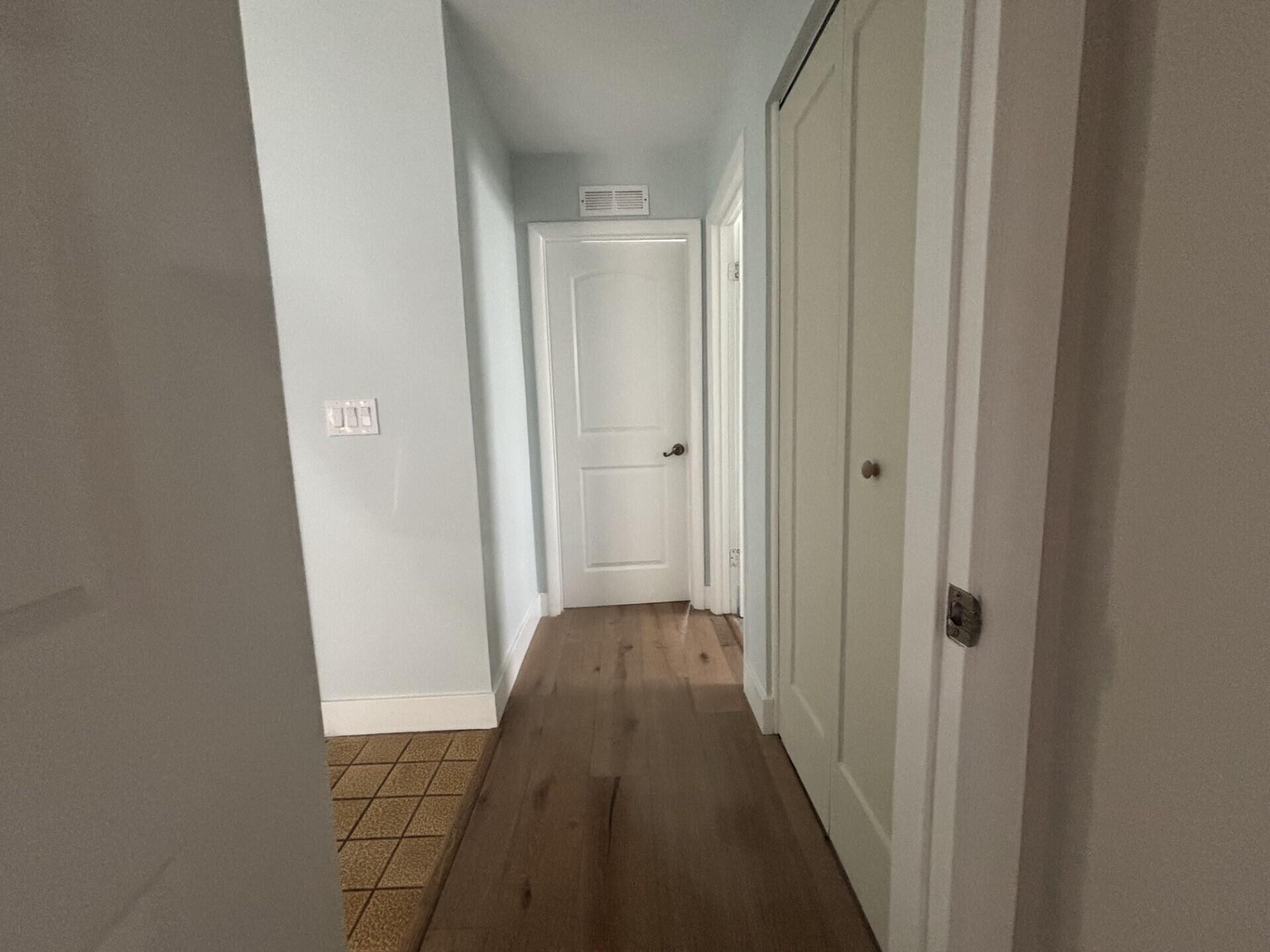 1160 East 12th Street Stuart, FL 34996 - Photo 15 of 25 a view of a hallway with a wooden door