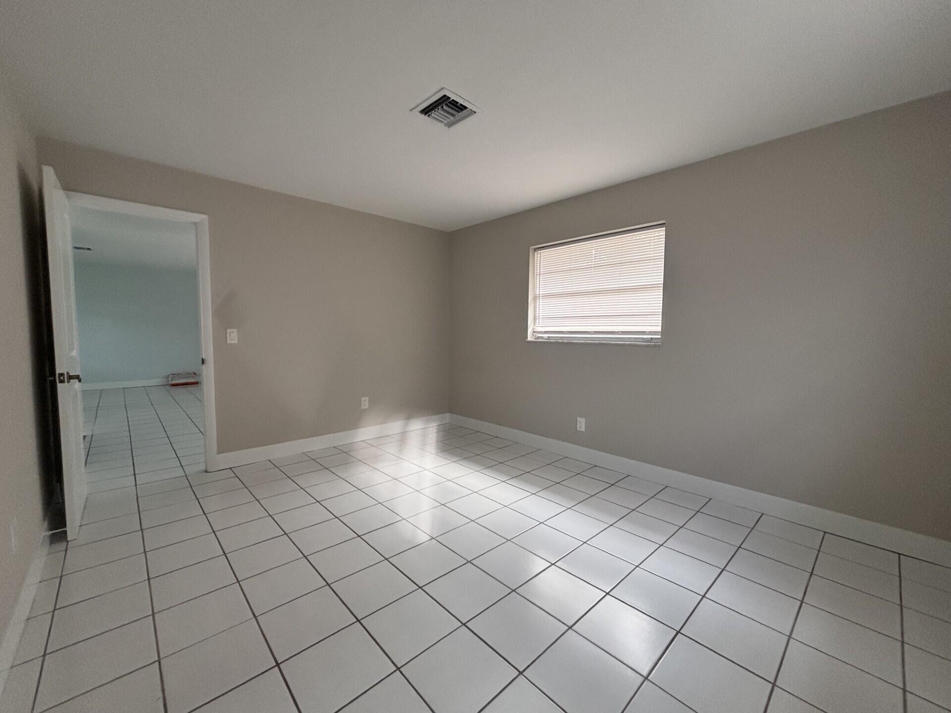1160 East 12th Street Stuart, FL 34996 - Photo 21 of 25 a view of an empty room and window
