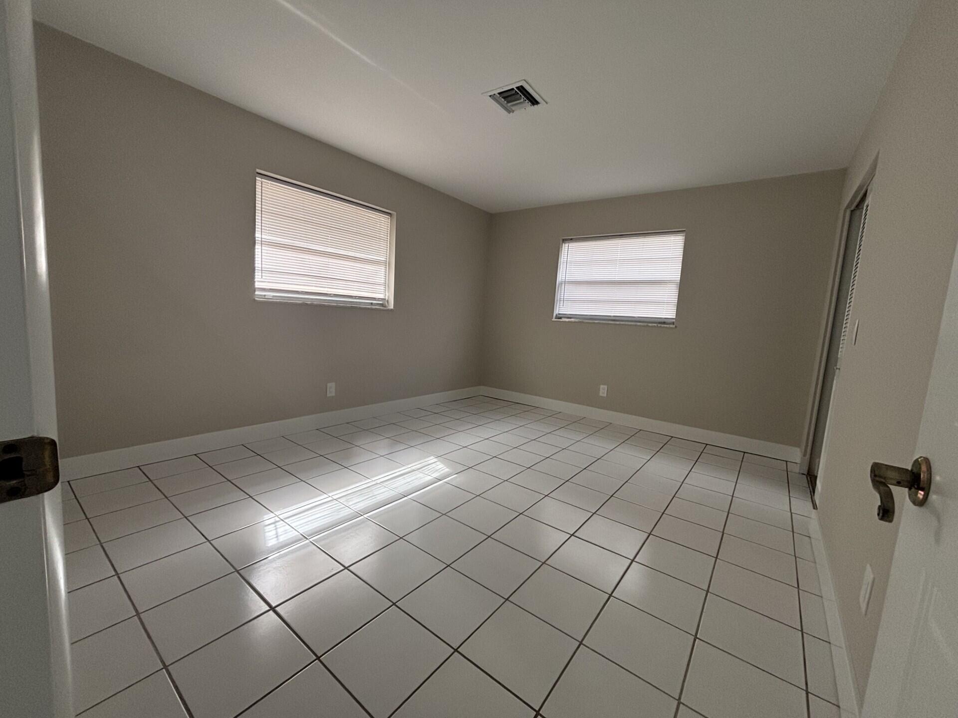1160 East 12th Street Stuart, FL 34996 - Photo 22 of 25 a view of an empty room and window