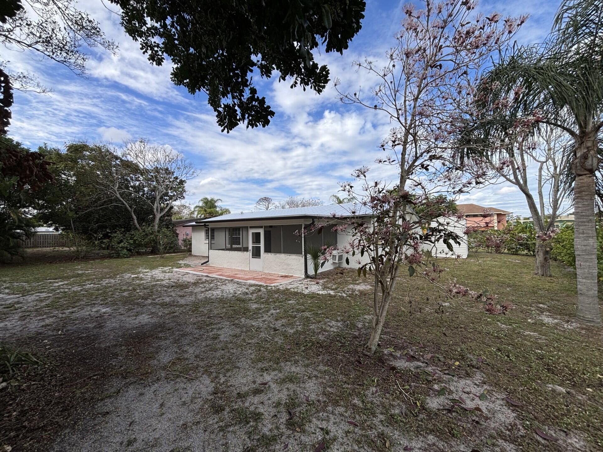 1160 East 12th Street Stuart, FL 34996 - Photo 25 of 25 a view of a house with a yard