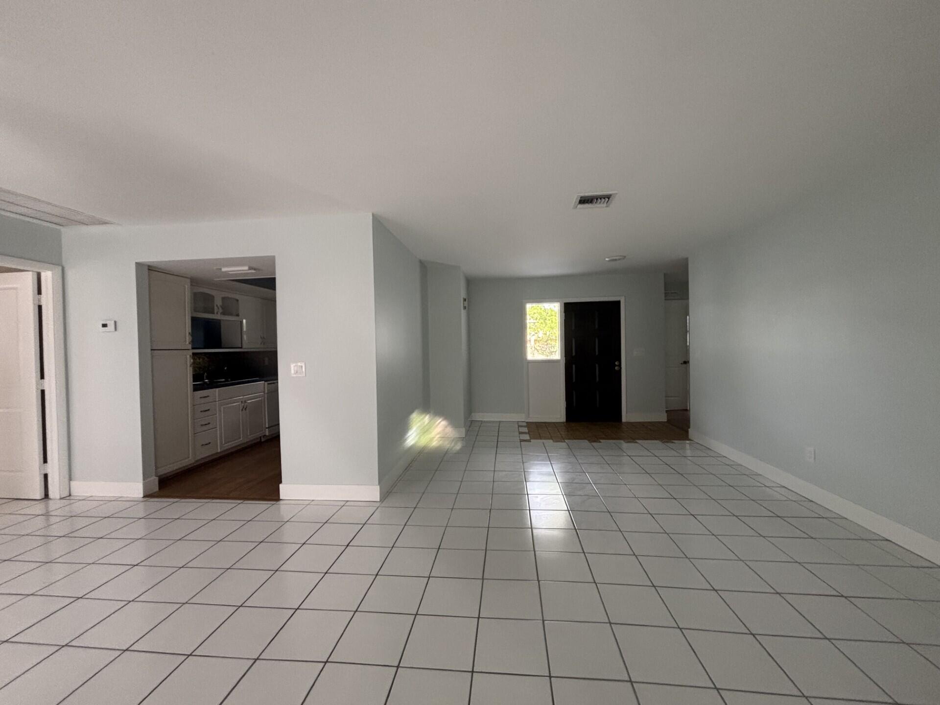 1160 East 12th Street Stuart, FL 34996 - Photo 7 of 25 a view of an empty room and window