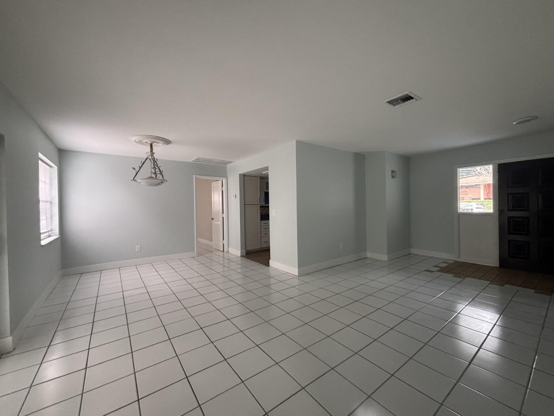 1160 East 12th Street Stuart, FL 34996 - Photo 8 of 25 a view of an empty room and window