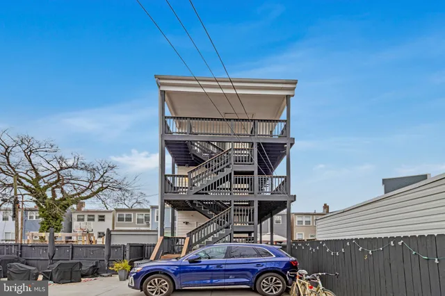 a front view of a building with garden