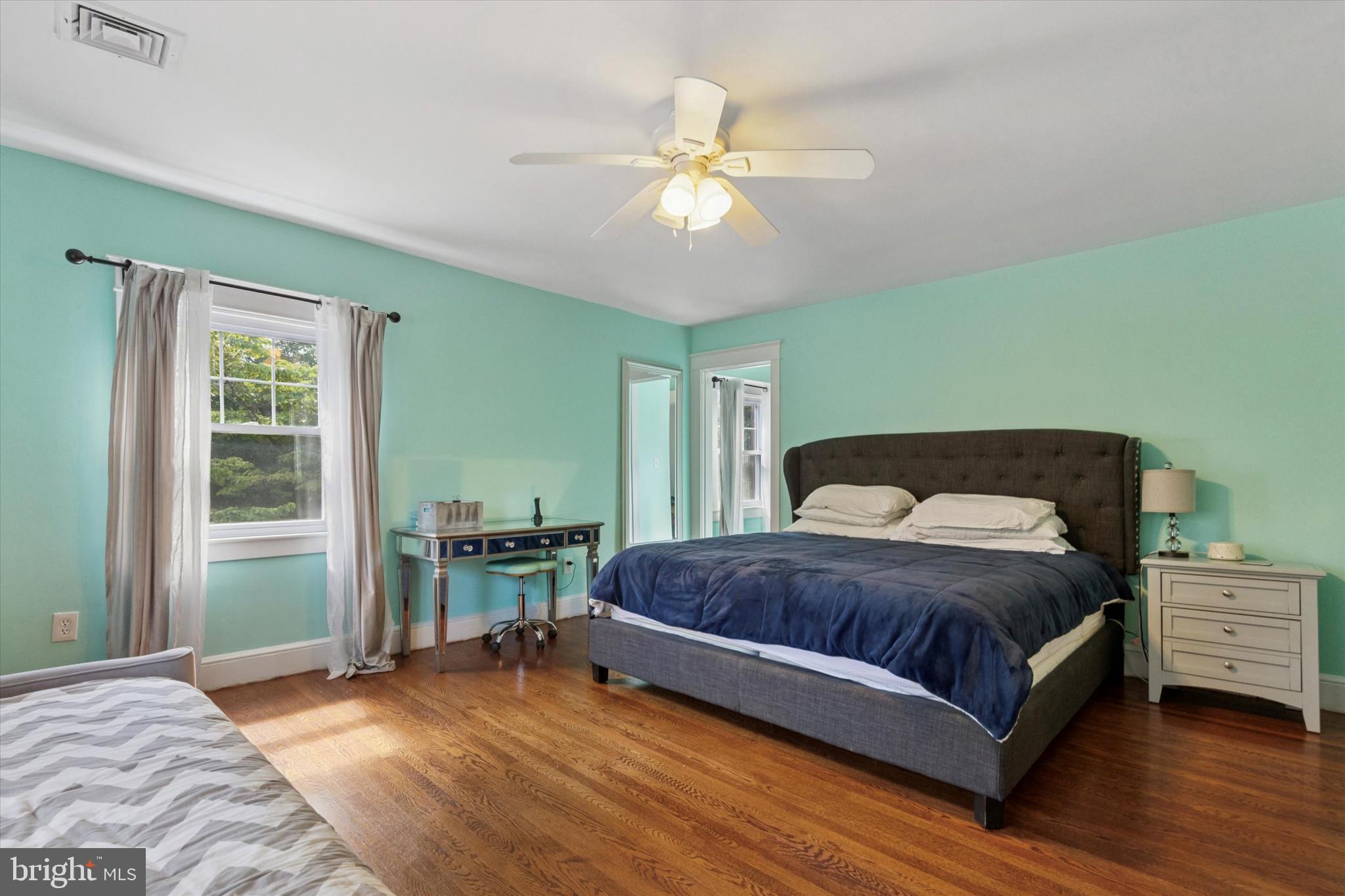 140 North Rolling Road Springfield, PA 19064 - Photo 22 of 34 a bedroom with a bed and a chandelier