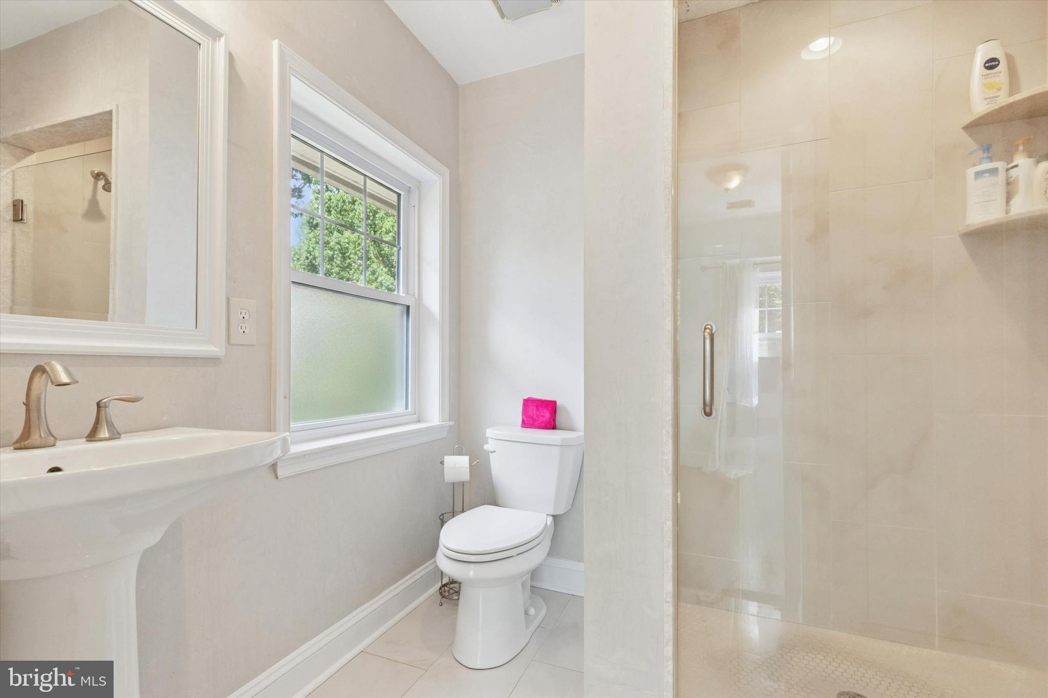140 North Rolling Road Springfield, PA 19064 - Photo 23 of 34 a bathroom with a sink toilet and shower
