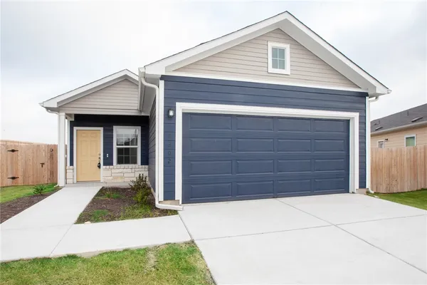 a view of house with garage