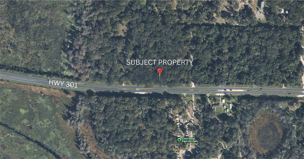 0 North N Highway Citra, FL 32113 - Photo 2 of 2 a view of a water fountain with large trees