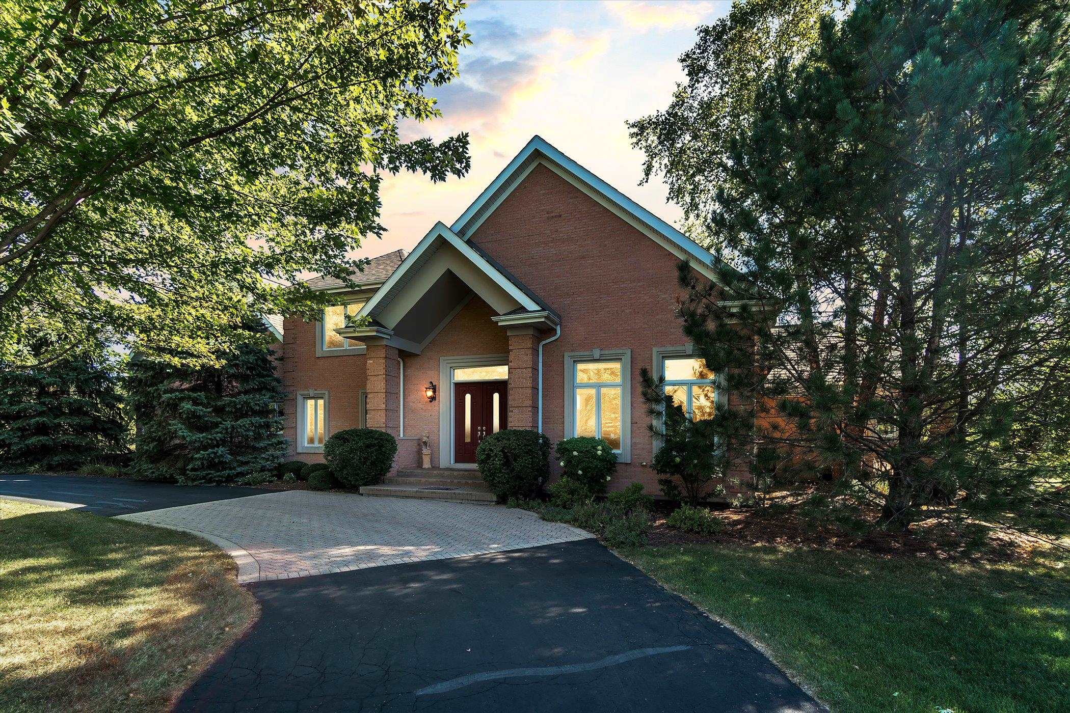 12535 Bellingham Road Caledonia, IL 61011 - Photo 1 of 57 a front view of a house with garden