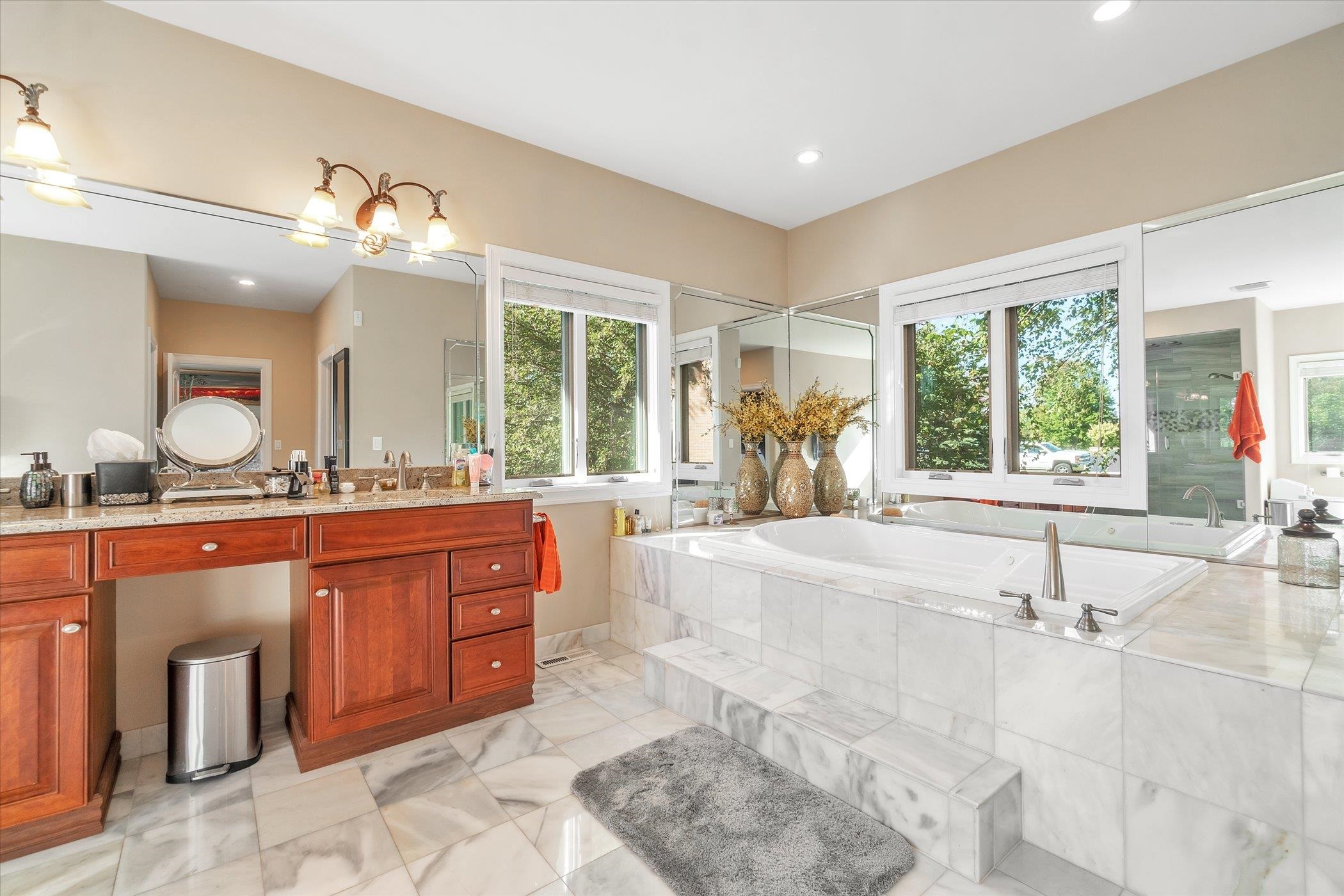 12535 Bellingham Road Caledonia, IL 61011 - Photo 28 of 57 a large bathroom with a large tub sink and outdoor space
