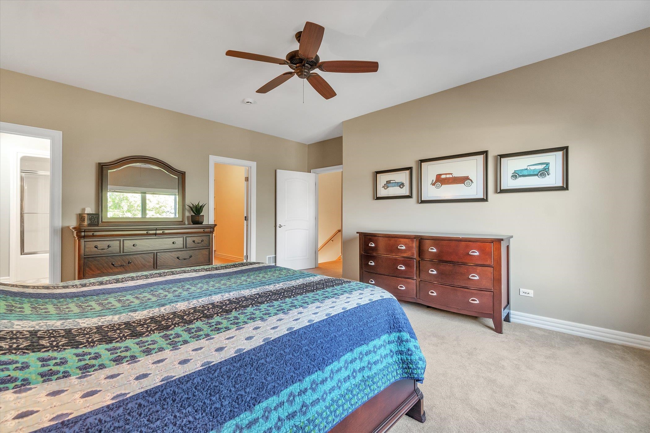 12535 Bellingham Road Caledonia, IL 61011 - Photo 45 of 57 a bedroom with a bed and a dresser in it